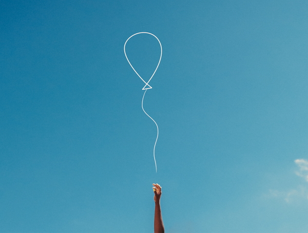 hand holding balloon